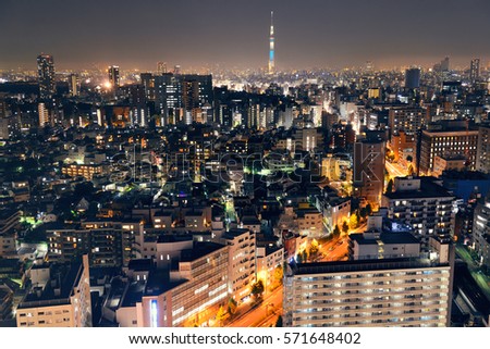 Urban skyline rooftop view at night, Japan.