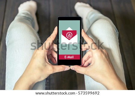 The woman received an e-mail online on a mobile phone. Message online icon. Email marketing.