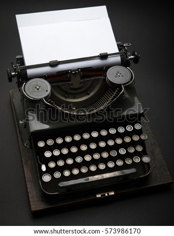 Antique Typewriter. Vintage Typewriter Machine on black.
