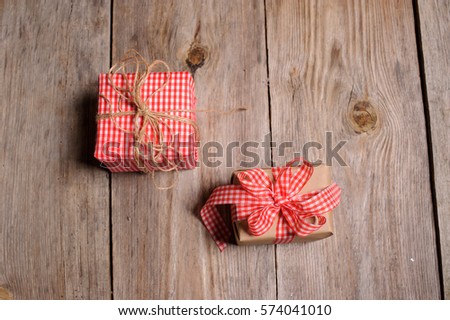Vintage gift box with ribbon on wooden background