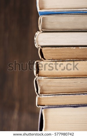 Old Books On The Wooden Background.