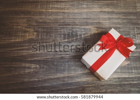 a gift box with wood background