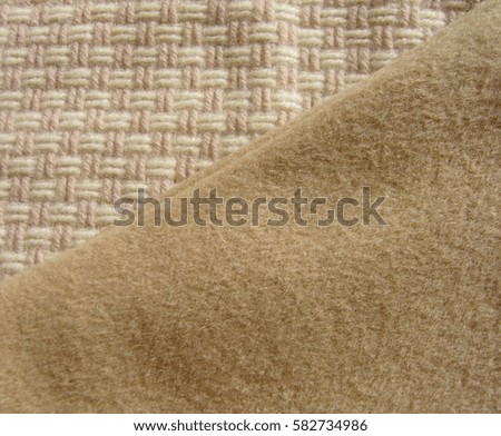 The texture of wool fabric. Beige wool fabric.
