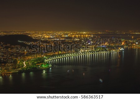 Night cityscape view from the Sugarloaf mountain on the Guanabara bay, Botafogo beach and district, Flamengo. Rio de Janeiro, Brazil.