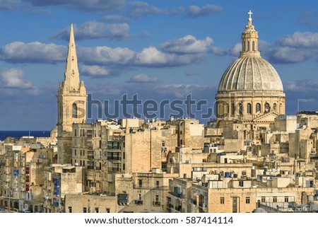 Valletta overview. View of a church dome over the roofs of Valletta, Malta
