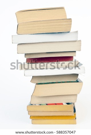 Books irregularly stacked.