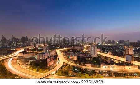 Aerial view Bangkok city downtown highway with twilight sky background