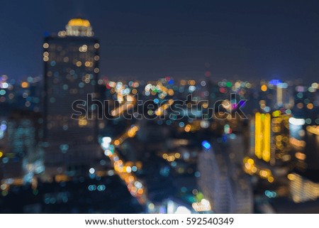 Night blurred bokeh light city downtown aerial view, abstract background