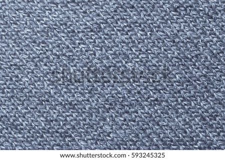 Blue textile background closeup. Structure of the fabric macro.
