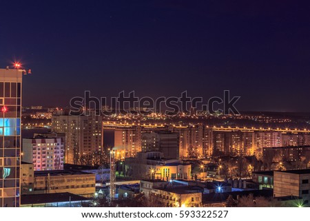 Night aerial cityscape view to urban modern apartment buildings in Voronezh from rooftop
