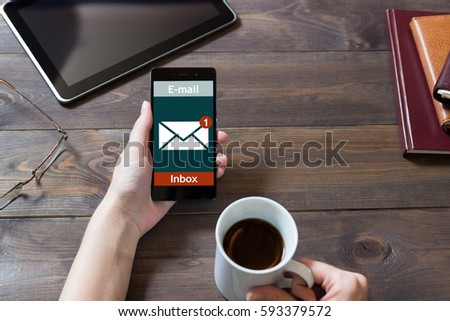The woman received an e-mail online on a mobile phone. Message online icon.