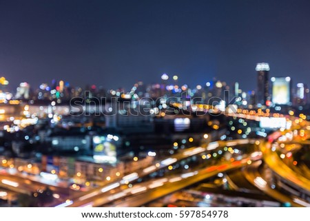 Aerial view blur light city and highway overpass, abstract background