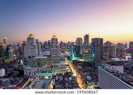 Aerial view of Bangkok modern office buildings, condominium, living place in  city downtown with sunset scenery, Bangkok is the most populated city in Southeast Asia.