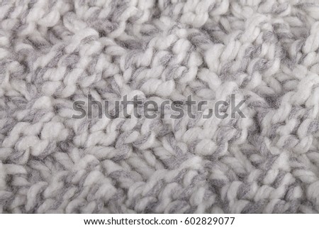 Knitted fabric texture. Knitting of handmade wool pattern background.