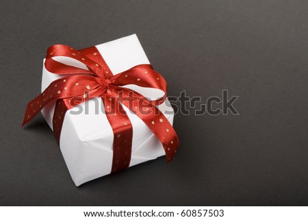 Gift with red ribbon.