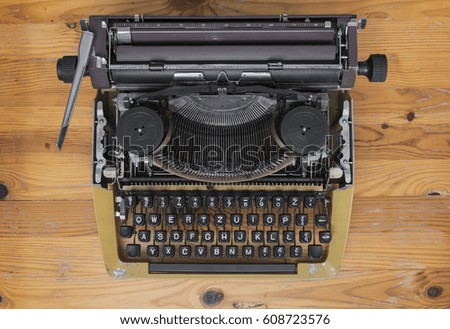 Old polish typewriter on wooden desk