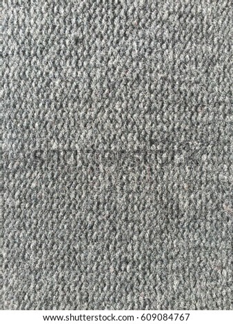 Close-up photo of black grey knitted crumpled textured surface background