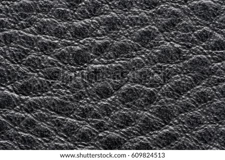 Black leather for manufacturing of shoes, clothes, bags and other fashion accessories, high quality natural seamless material sample, textured background, top view 