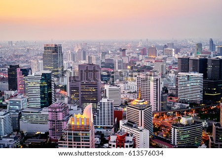 Evening in megapolis. Beautiful cityscape with top view on skyscrapers. Bangkok, Thailand.