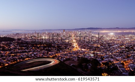Dusk View From Twin Peaks to San Francisco, California, USA. Car Trails Visible from Long Exposure.