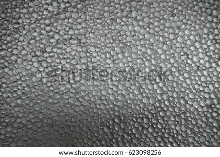 Polystyrene foam close-up. Lots of small and large bubbles styrofoam texture background.