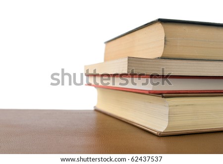 four books over desktop with free space on the letf