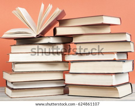 Open book, hardback books on wooden table. Back to school. Education concept.