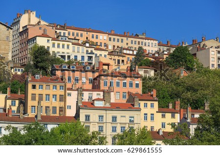 The colorful, old apartments of Croix Rousse, the famous first arrondissement of Lyon, France.