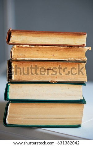 the texture is a stack of old books. Texture or background. Close up