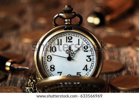 Pocket watch on wooden background