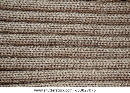 the texture of the plain knitted fabric , brown
