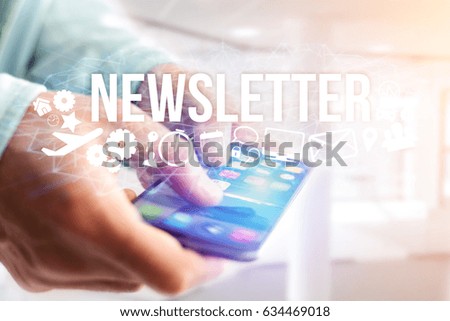 Concept view of man holding futuristic interface with newsletter title and multimedia icons flying all around - Internet concept