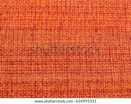 Close up Detail of patterns of rude, orange-red fabric