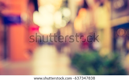 Abstract blur background image of steet  shopping mall with vintage tone look.