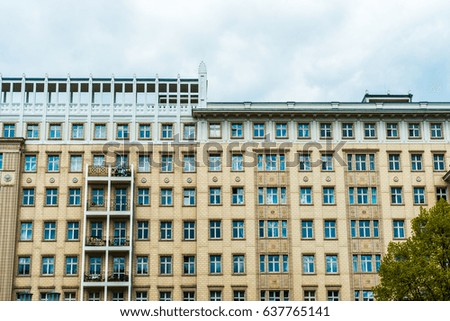 high contrasted apartment building with orange facade