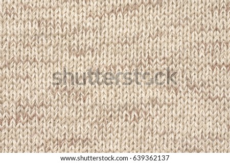 Knitted cloth plain stitch texture of melange neutral colored linen yarn.