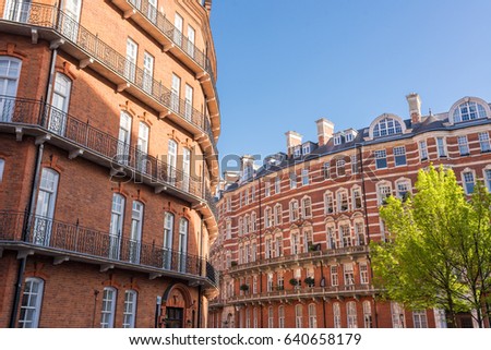 Opulent restored elegant Victorian period building in red bricks and white windows in South Kensington, London, UK