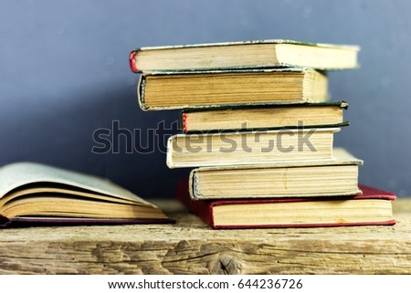 Books on an old wooden table