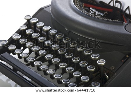 Vintage portable typewriter close up on keys on white.