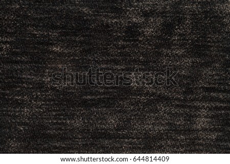 Dark brown background of soft, fleecy cloth. Texture of light umber nappy textile, closeup.
