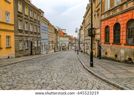 The capital city of Poland and the beautiful colourful historic houses with streets in the Old Town Warsaw.