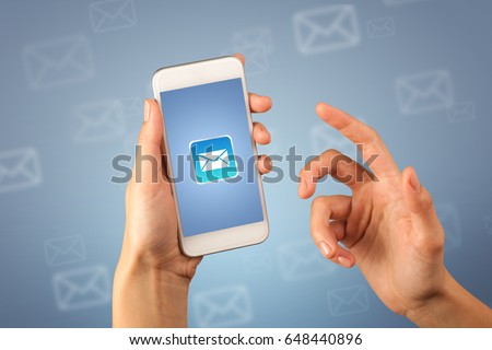 Female fingers touching smartphone with mail icon on it