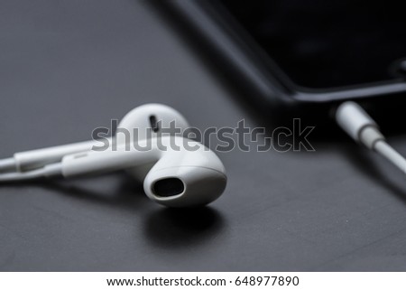  Earphones device with mobile phone, selective focus
