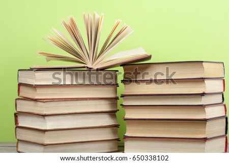 Open book, hardback books on wooden table. Back to school. Copy space for text.Education concept.