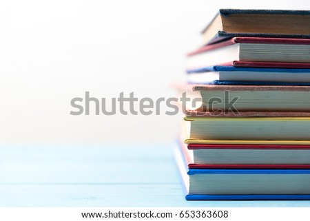 book stack on blue wooden table
