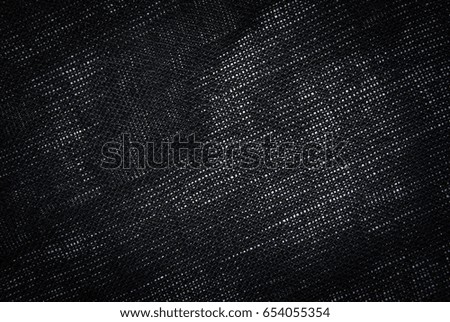Black textile background, cotton texture. Fabric textile material. Empty space for design.