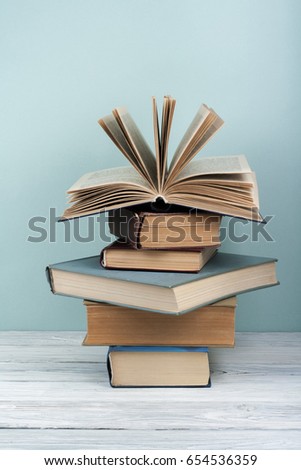 Stack of colorful books. Education background. Back to school. Book, hardback colorful books on wooden table. Education business concept. Copy space for text