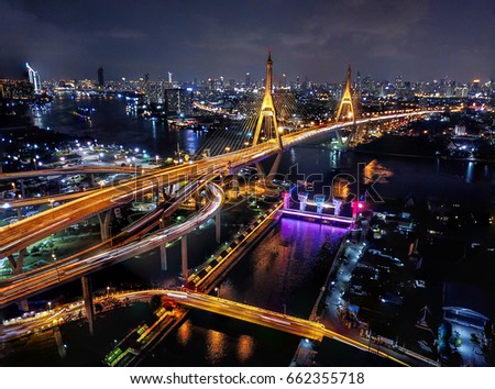drone view night bhumibol bridge city light car on bridge bangkok thailand selective focus 
