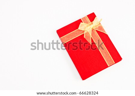 Ribbon on red notebook isolated on white background
