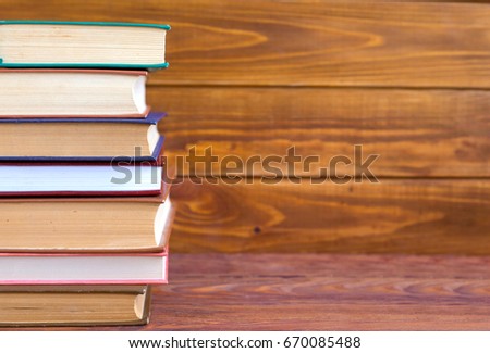 many colorful books on shelf